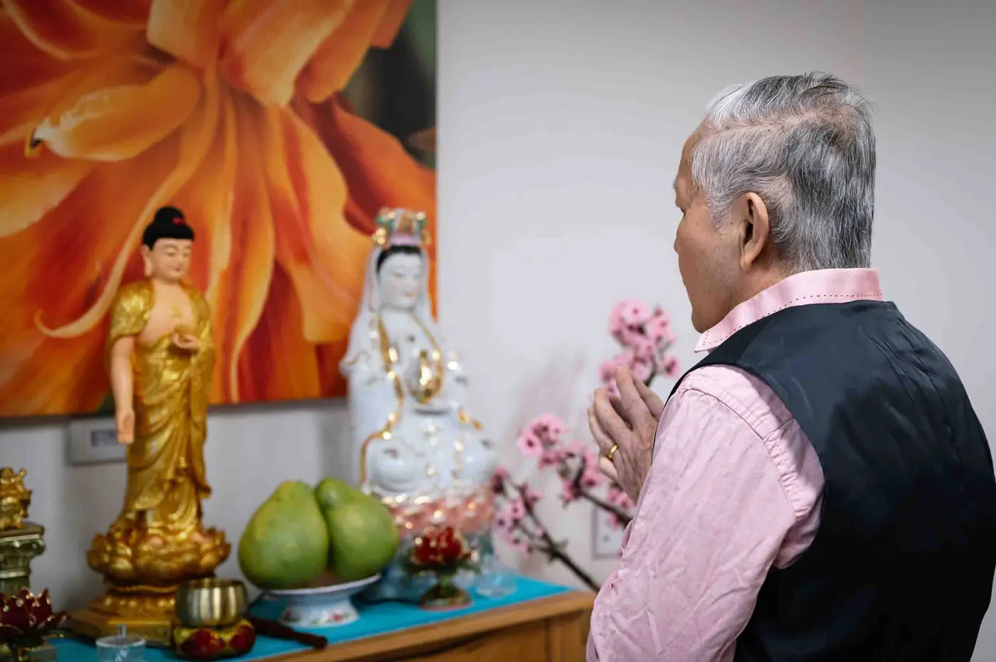 A resident at a Buddhist shrine in his room at Nexia Aged Care Footscray