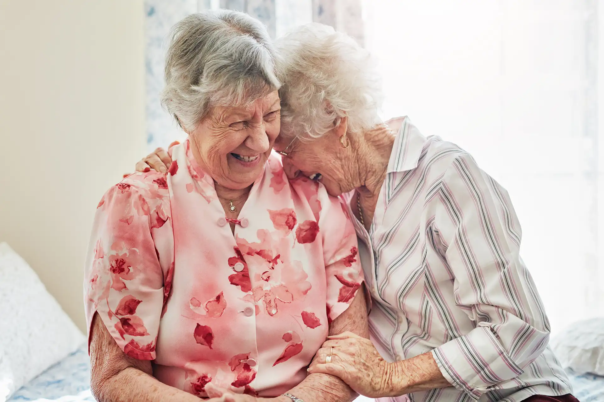 Residents enjoying time together in the gardens at a Nexia Aged Care home